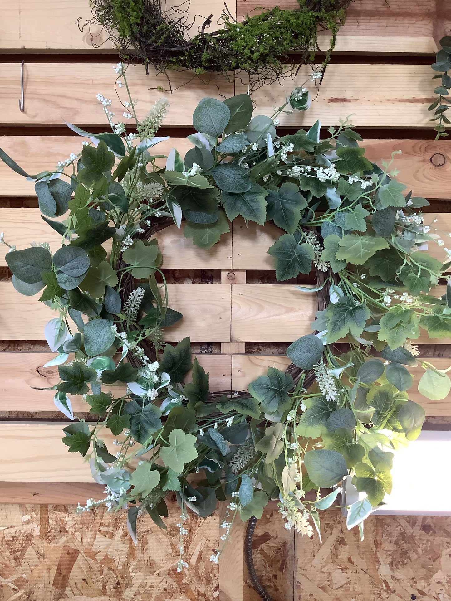 Mixed foliage wreath 24” green and white leaves