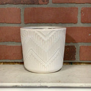 White pot with arrow line design