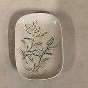 Stoneware dish with plant