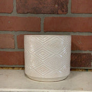 White pot with diamond design